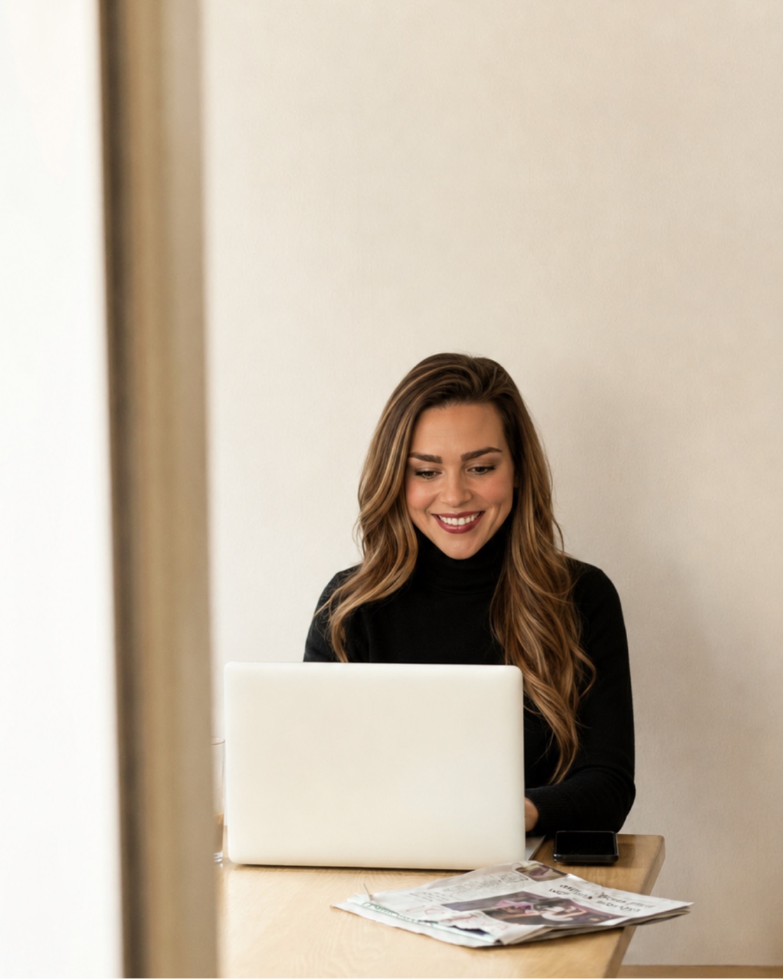 Rylee, founder of Waypoint, working at her laptop
